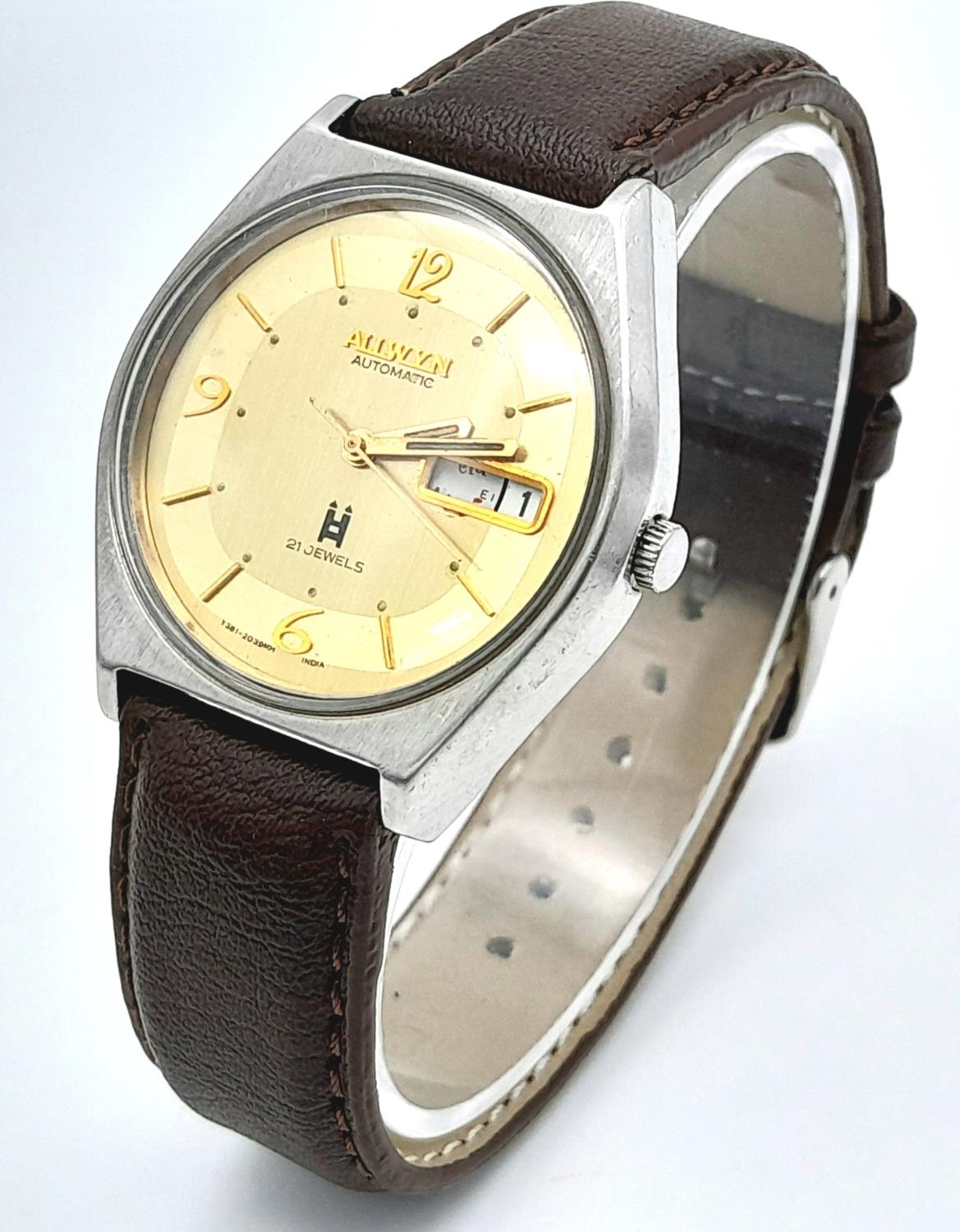A Vintage Allwyn Automatic Gents Watch. Brown leather strap. Stainless steel case - 36mm. Yellow