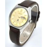 A Vintage Allwyn Automatic Gents Watch. Brown leather strap. Stainless steel case - 36mm. Yellow