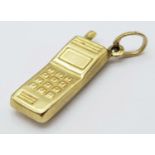 A 9K YELLOW GOLD MOBILE PHONE CHARM 0.8G , 20mm x 18mm. SC 9017