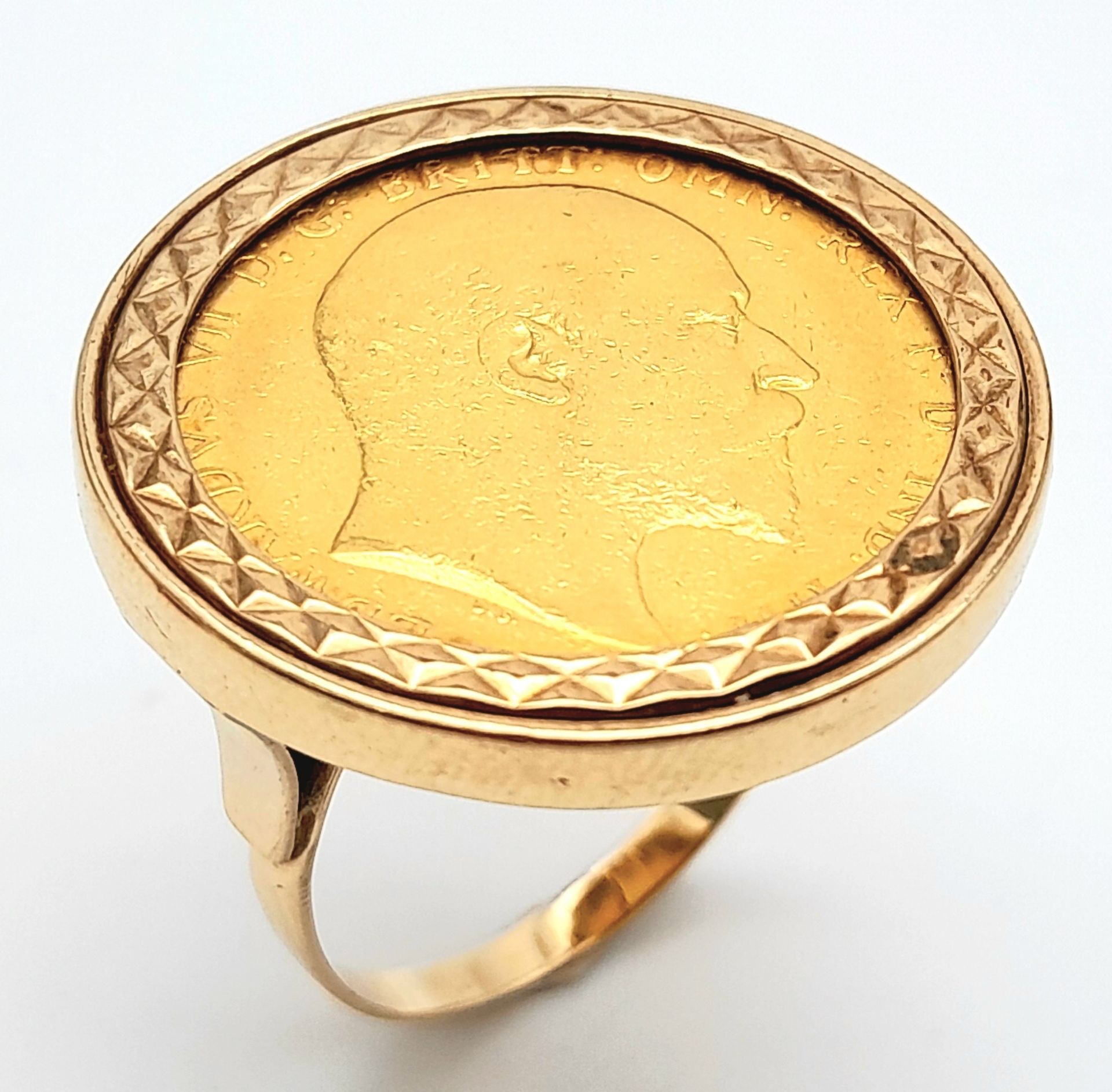 A 9 K yellow gold ring with a full 1902 sovereign which is not welded to the ring and can easily