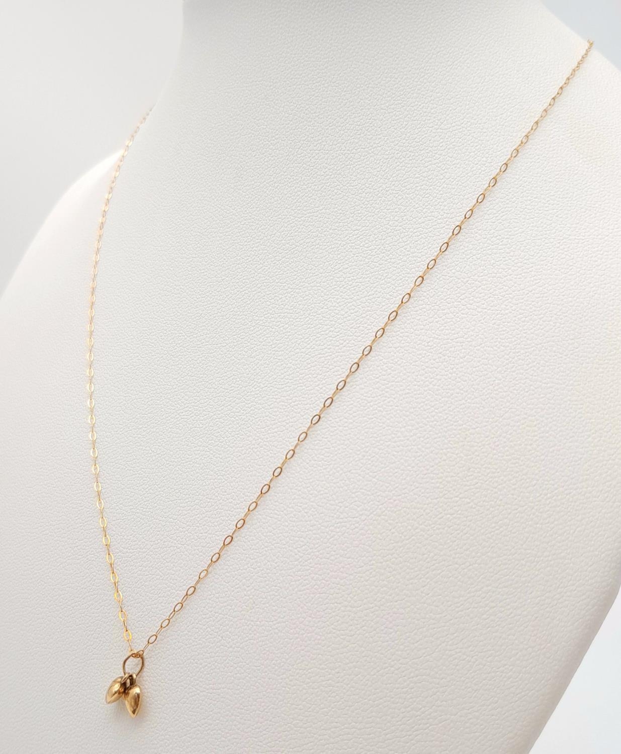 A 9ct Yellow Gold Double Heart Necklace, 16” length, 0.6g total weight , 0.7cm pendant drop. ref: - Image 2 of 5