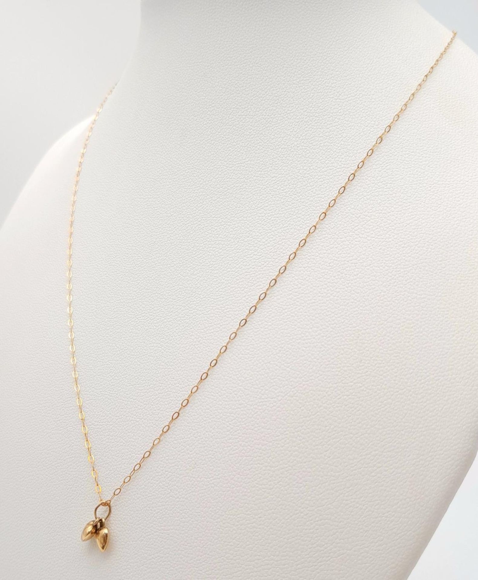 A 9ct Yellow Gold Double Heart Necklace, 16” length, 0.6g total weight , 0.7cm pendant drop. ref: - Image 2 of 5