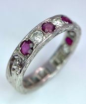 AN 18K WHITE GOLD DIAMOND & RUBY BAND RING. 0.25ctw, size L, 4.1g total weight. Ref: SC 9038