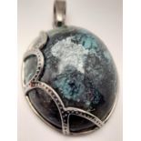 A 64ct Large Oval Cut Turquoise 925 Silver Pendant. W-18g. Comes with a presentation case. 5cm. Ref: