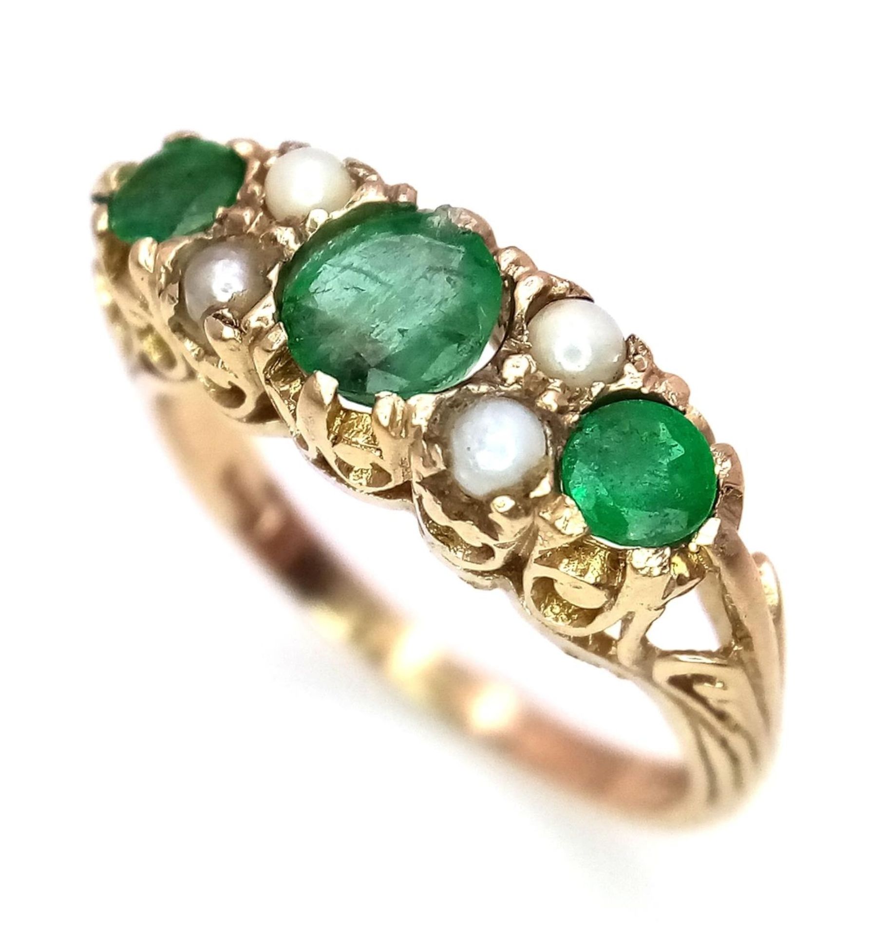 A 9K Yellow Gold Emerald and Seed Pearl Ring. Size P, 3.52g total weight.