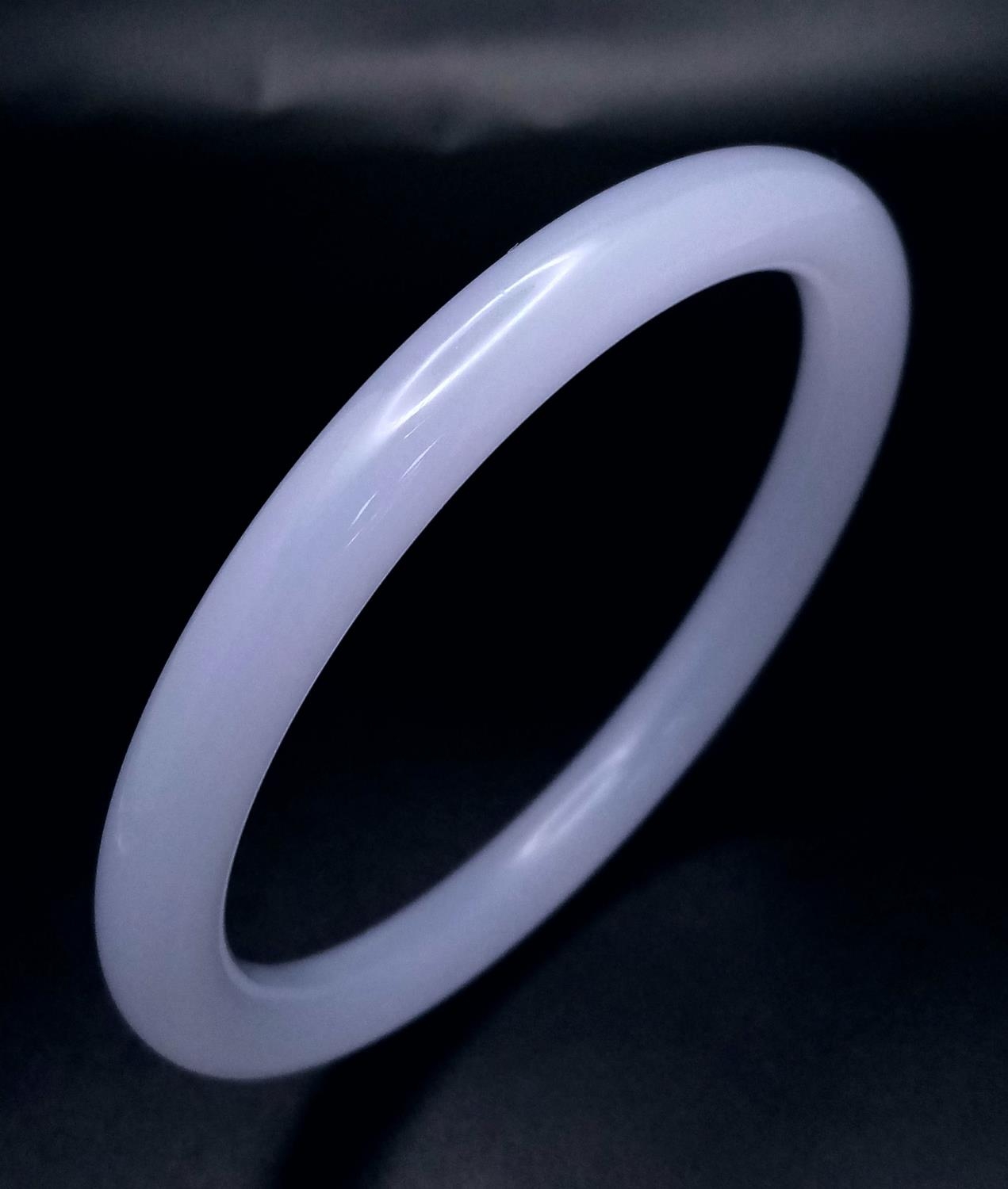 A Chinese Thin Lavender Jade Bangle. 7mm width. 60mm inner diameter.