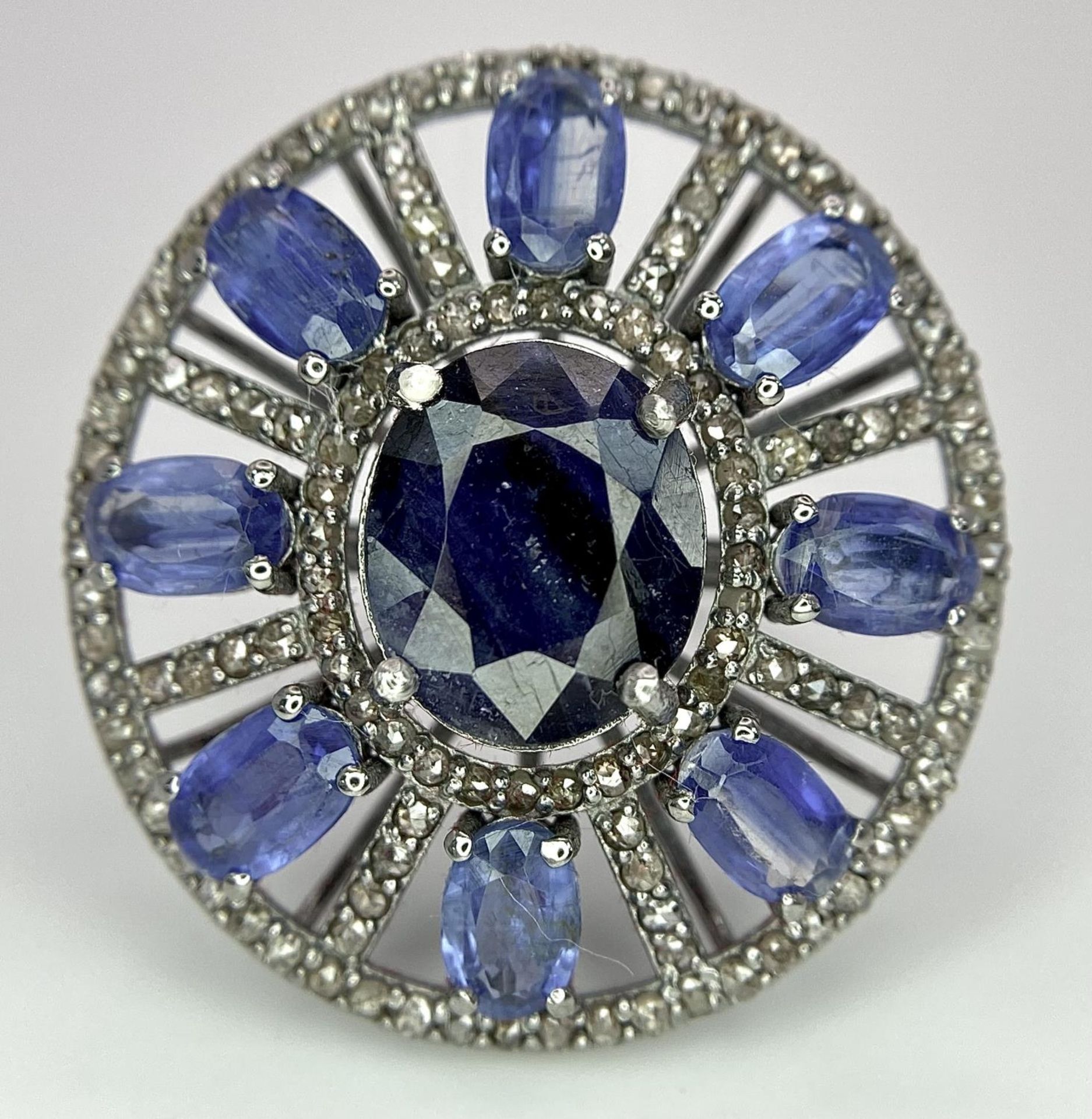 A 10ct Topaz Ring with 6.15ctw of Kyanite surround and 0.50ctw of Diamond Accents. Set in 925 - Image 3 of 6