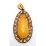 An Australian Fire Opal Pendant with Yellow Sapphires and Old Cut Diamond Surround set in Gilded 925