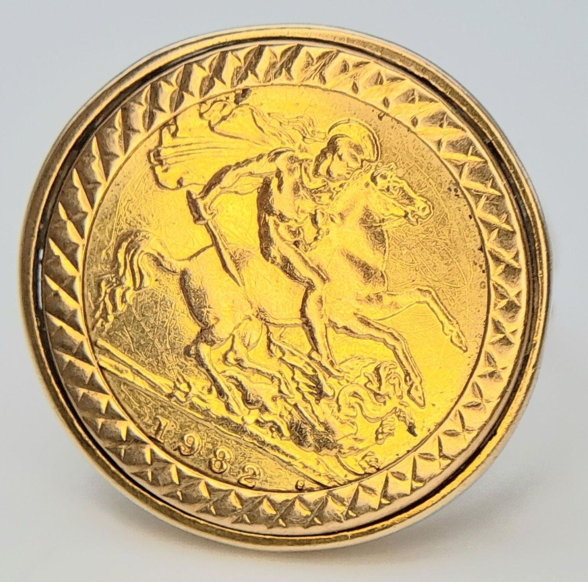 A 1982 22K GOLD HALF SOVEREIGN SET IN A 9K GOLD RING . 7.1gms sized T