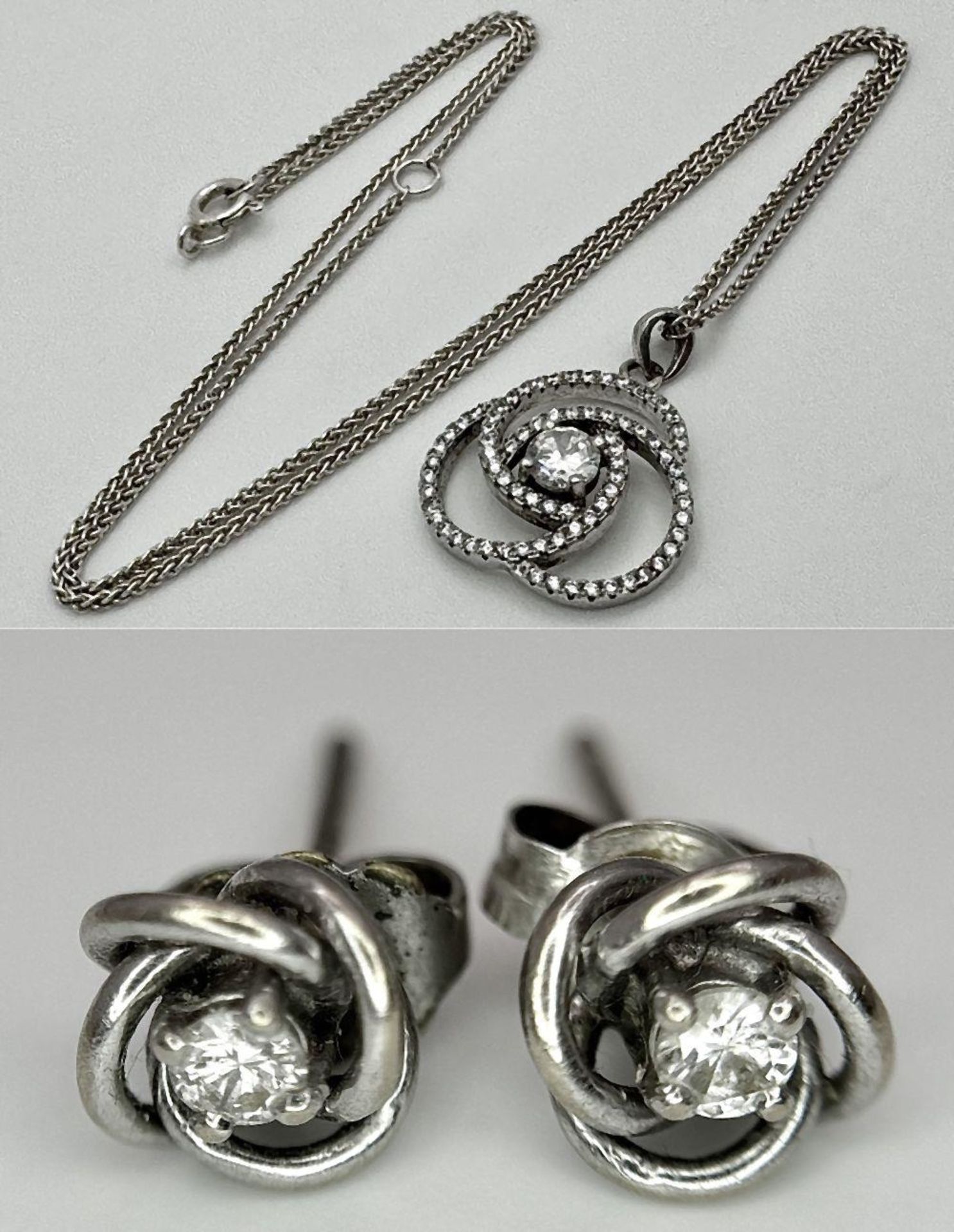 A STERLING SILVER STONE SET SPIRAL PENDANT ON CHAIN WITH A PAIR OF STERLING SILVER STONE SET