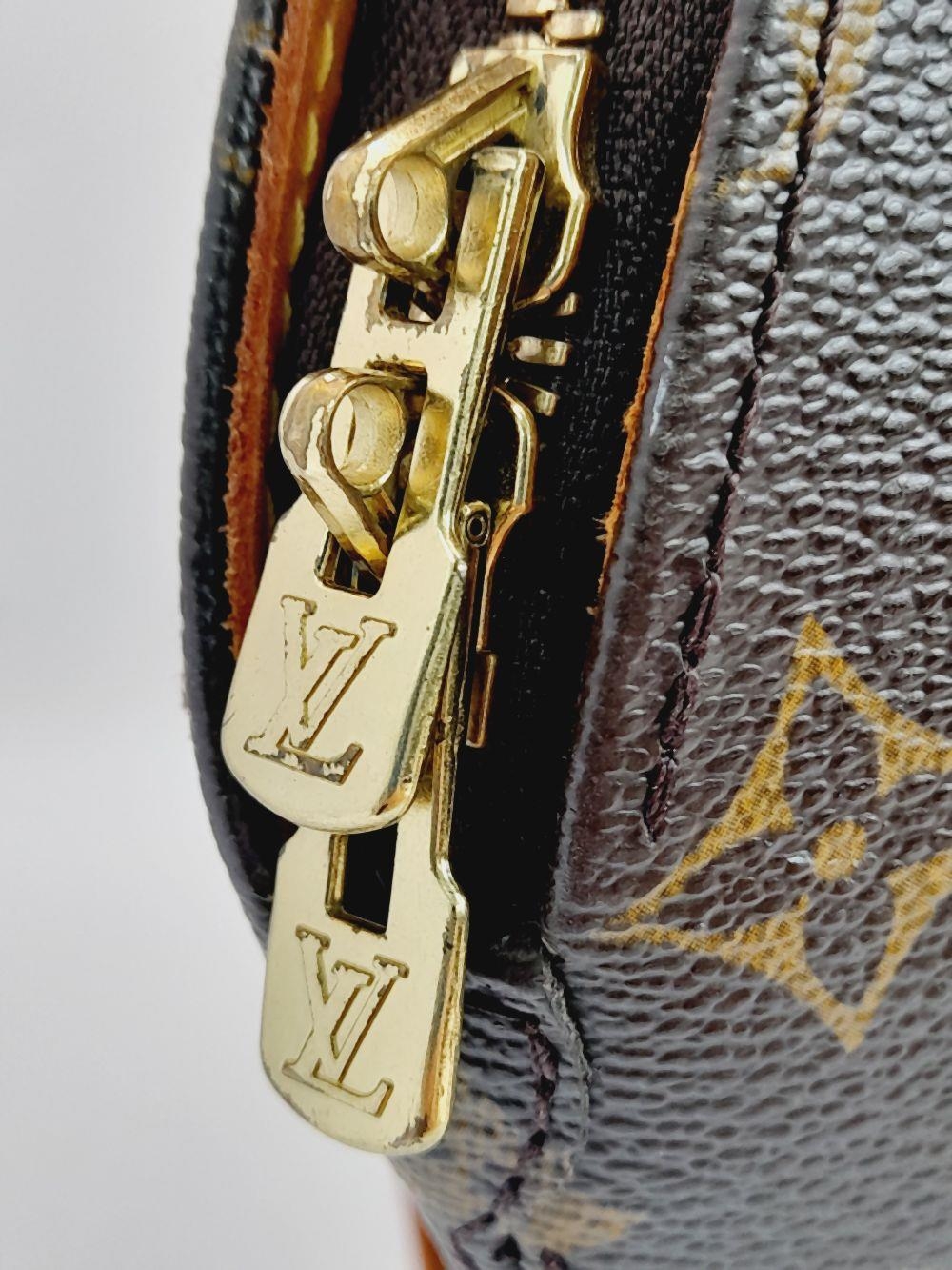 A Louis Vuitton Ellipse Handbag. Monogram canvas exterior with leather trim, two rolled leather - Image 2 of 11