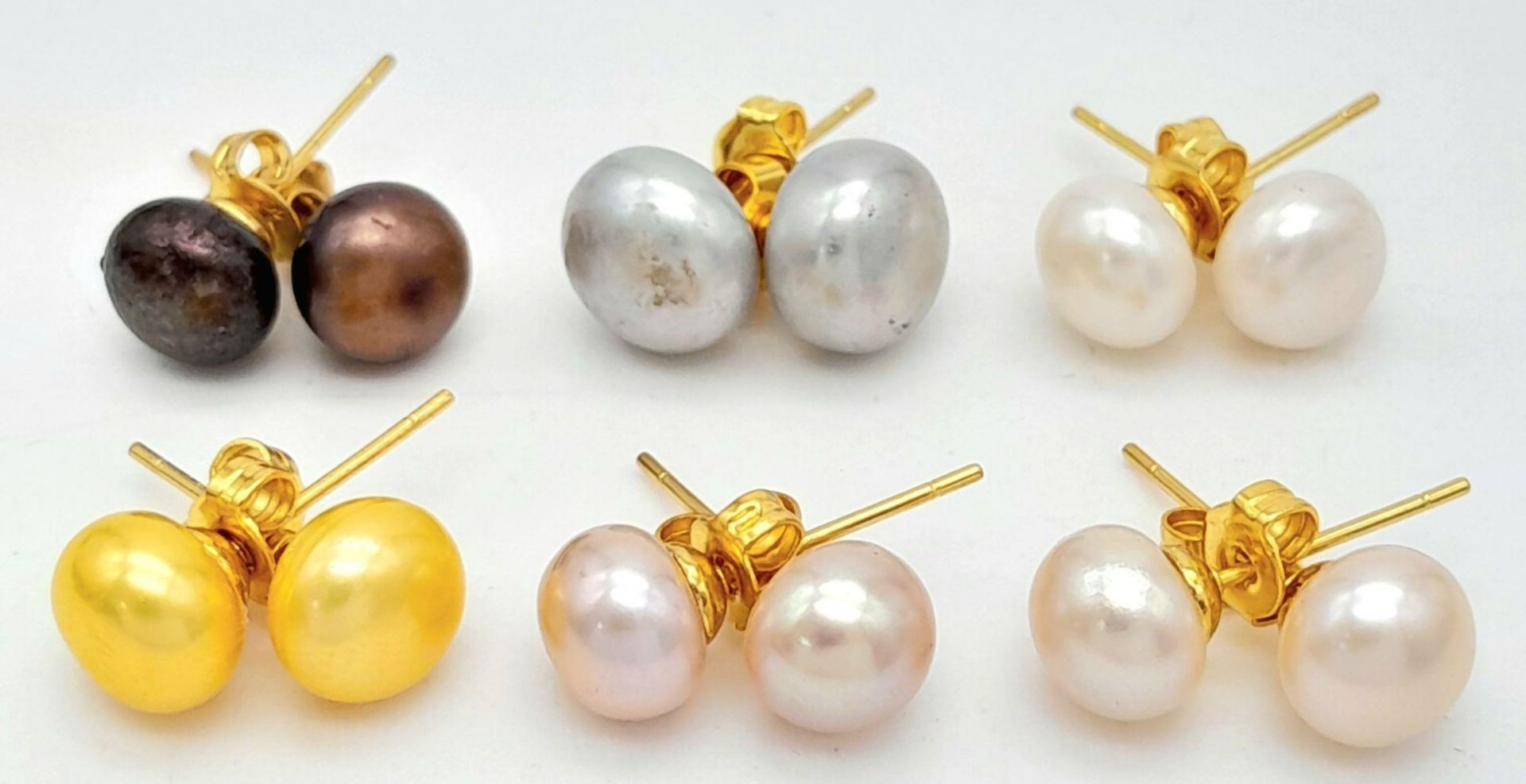 Six Pairs of Vibrant Colour Freshwater Pearl Earrings. Gilded metal finish.