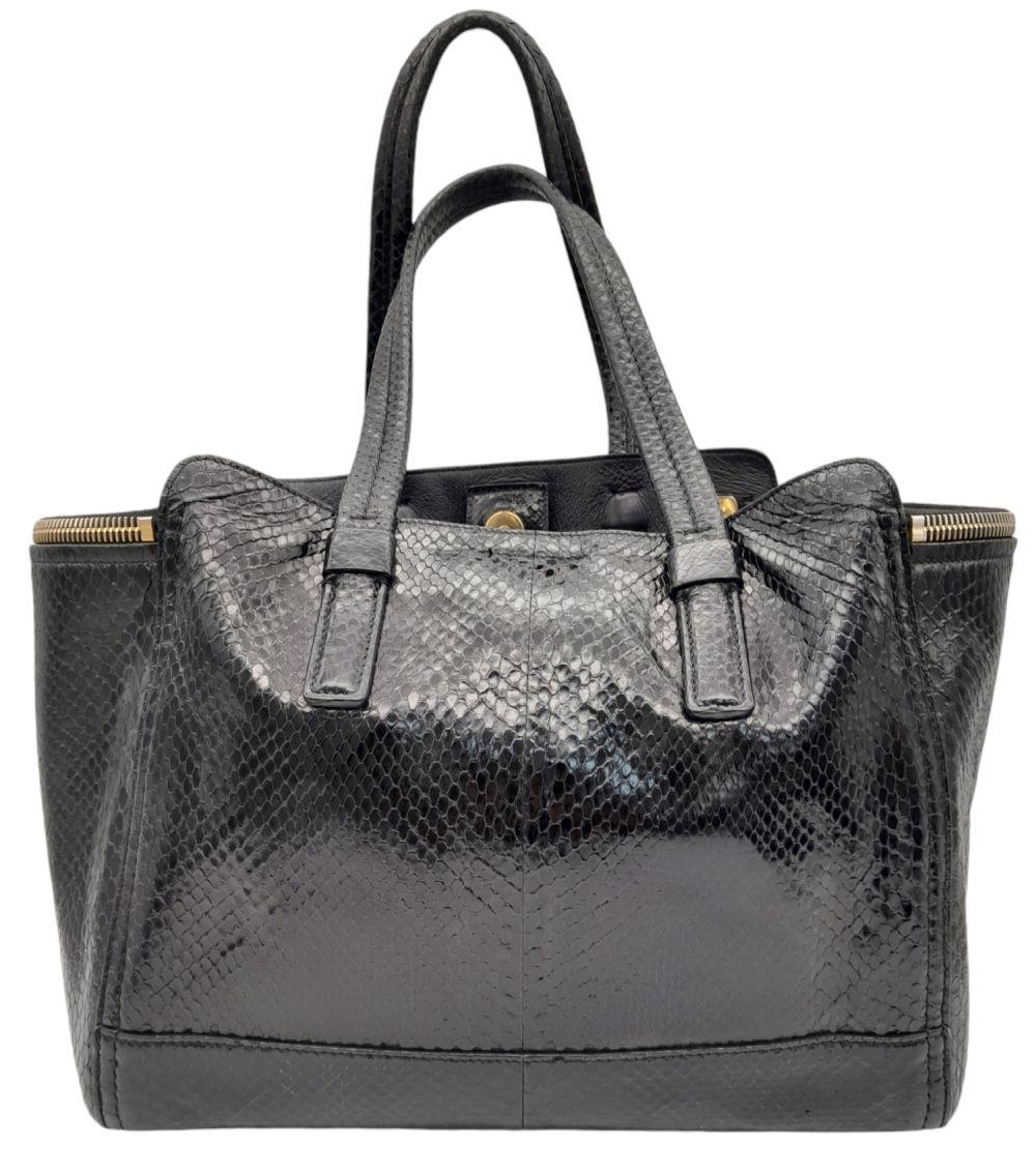 A Salvatore Ferragamo Black Verve Shoulder Bag. Python leather exterior with gold-toned hardware, - Image 3 of 8