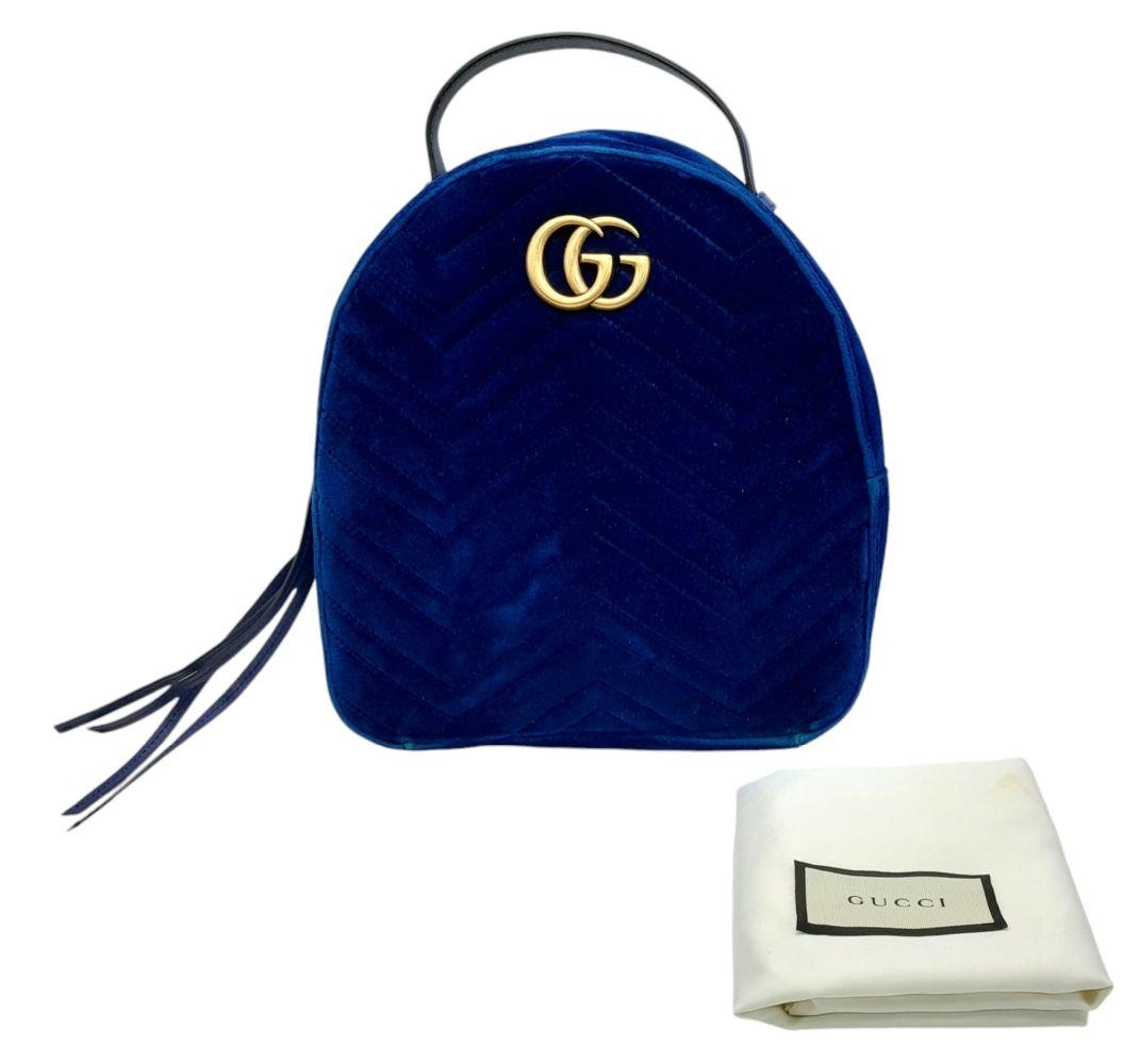 A Gucci Marmont Blue Velvet Backpack. Gold tone hardware. Blue leather straps. Pink textile - Image 2 of 10