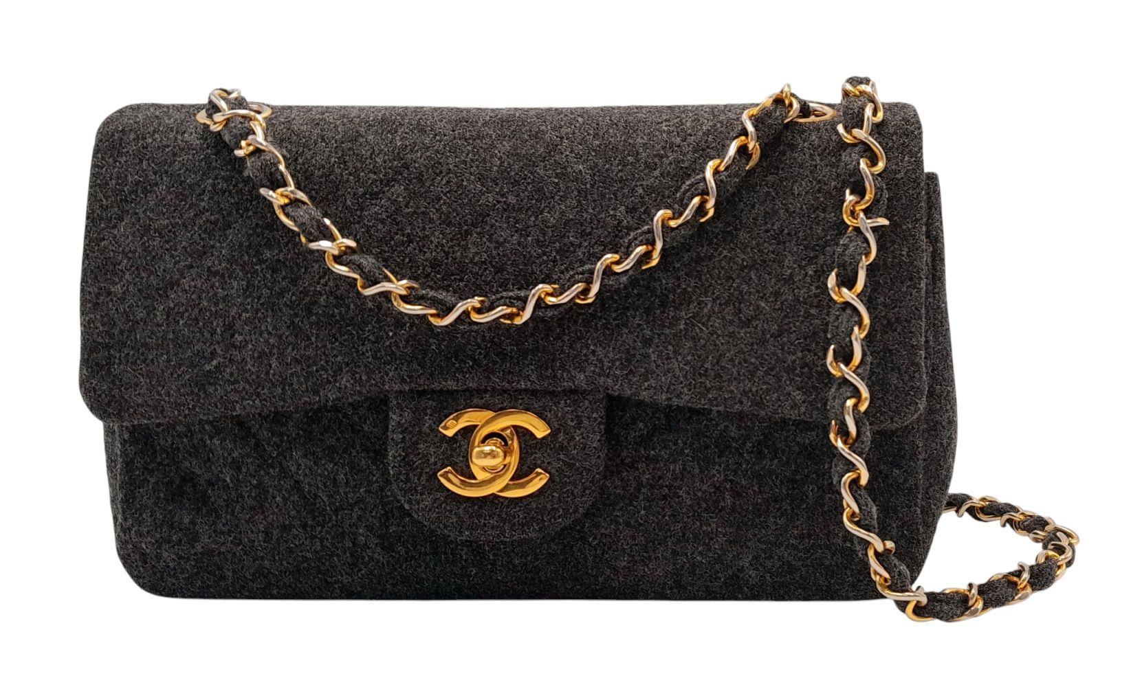 A Chanel Grey Wool Small Double Flap Bag. Grey wool exterior with gold-toned hardware, featuring