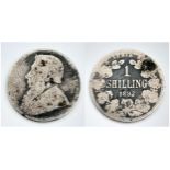 An 1892 South African One Shilling Silver Coin. Please see photos for conditions.