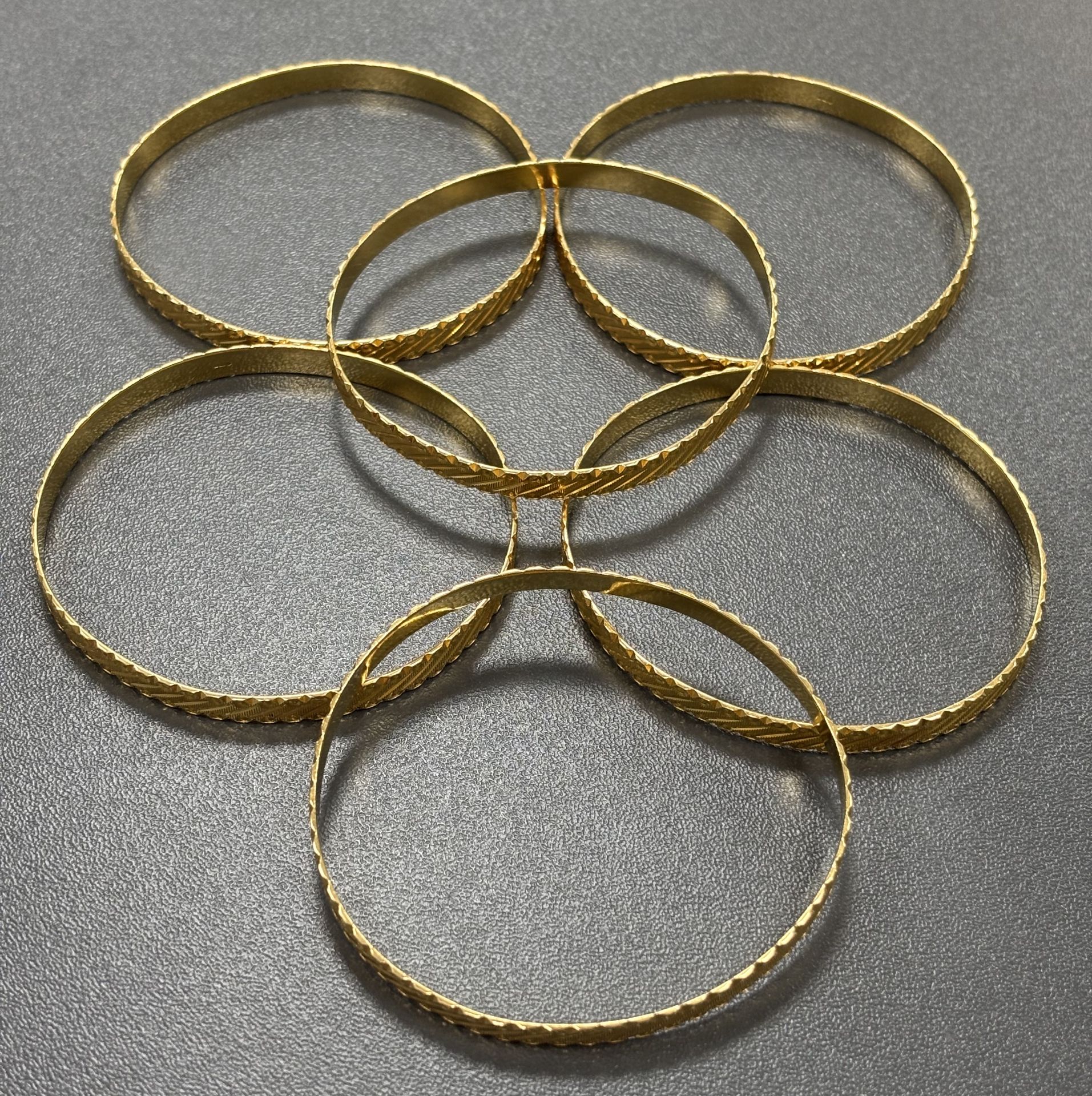 Withdrawn - A Lot of Jewellery: Six 22K Yellow Gold Bangles A/F. 81.2g.