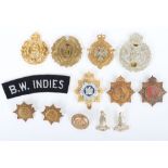 Grouping of West Indian metal, anodised cap, button,cloth & collar badges