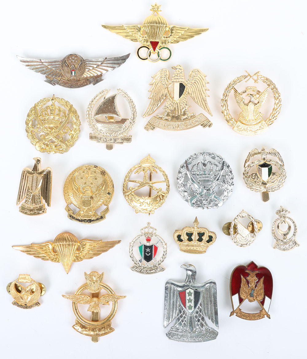 Large quantity of Middle East Military metal cap & collar badges