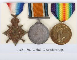 A Great War 1914-15 Star medal trio to a Private in the Devonshire Regiment who was discharged unfit