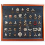 Framed Collection of British Infantry Cap Badges and Shoulder Titles