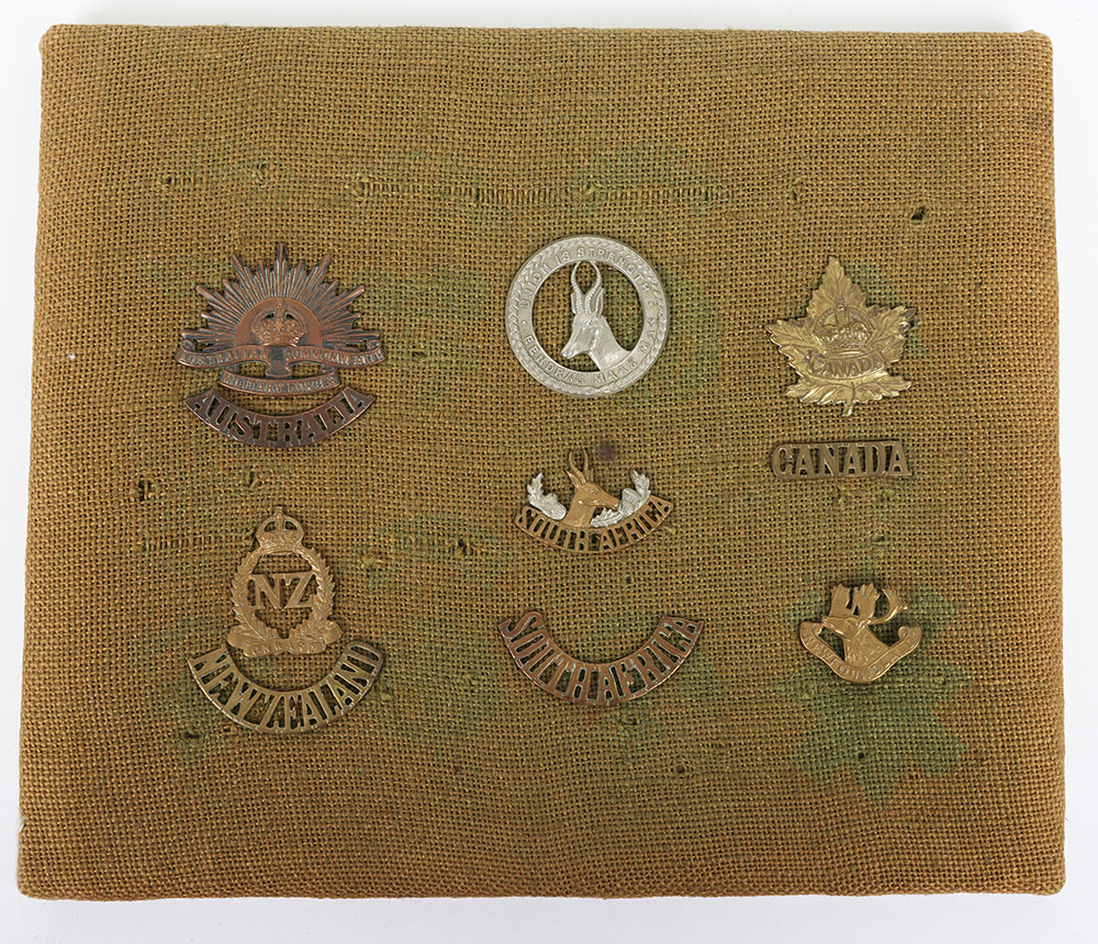 Small collection of Australian, South African & Canadian cap badges and shoulder titles