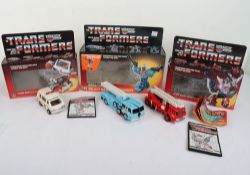 Three Vintage G1 Transformers Autobot Medic Ratchet boxed, Autobot Search and Rescue Inferno boxed a
