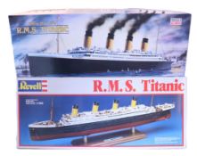 Two 1:350 scale Titanic Ocean Liners and two 1:400 scale Warship plastic model kits,