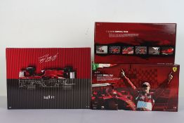 Three Michael Schumacher Retirement Series Ferrari Formula One 1:18 Scale Model Cars.