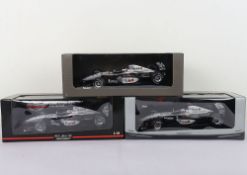 Three McLaren Collection Formula One 1:18 Scale Model Cars.