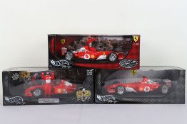 Three Hot Wheels Racing Ferrari Formula One 1:18 Scale Model Cars.