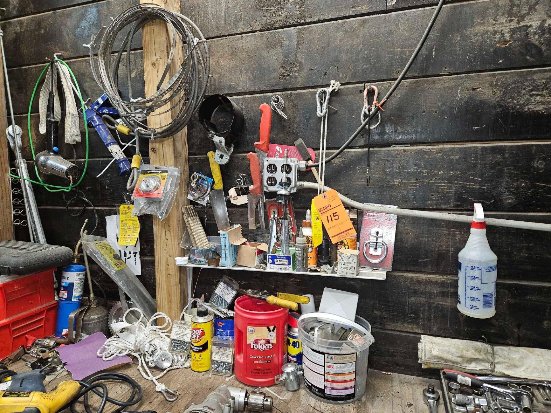 Lot of assorted screws, bolts, cutting knives, surface anchors, contents of items on wall and