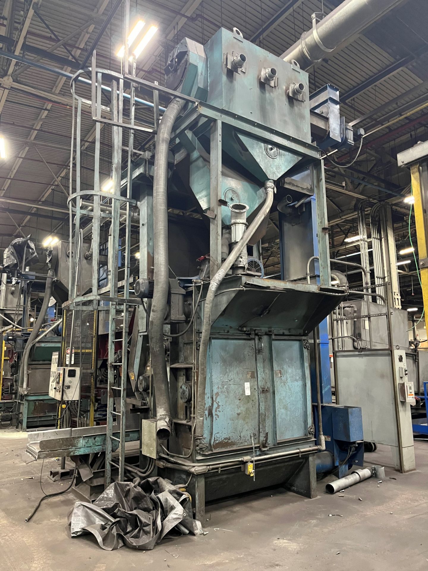 Wheelabrator tumble blast finishing machine