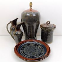 An Art Pottery lamp base, decorated fish, a matching storage jar, a graduated set of jugs, and a