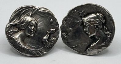 Two Armand Bargas silver buttons