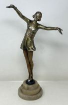 An Art Deco figure of a young lady, on an albaster base, 37 cm high
