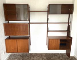 A Ladderax teak sectional wall unit disassembled, image taken in the property before removal