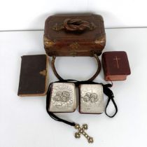 A late Victorian tooled leather box, two silver mounted prayer books, two other prayer books, a