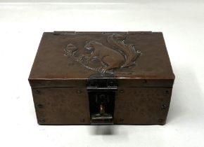 A John Pearson copper box, decorated a squirrel and acorns, monogrammed J P, 17 cm wide no reason to