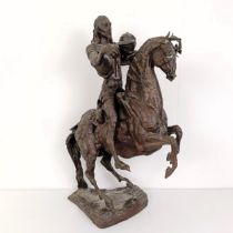 A 20th century bronze group, of a horse and rider, 50 cm high