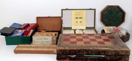 A chessboard, in the form of a book, a mahogany box, assorted playing cards and game tokens (box)