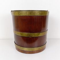 A 19th century mahogany and brass bound bucket, with a ring handle, 50 cm high