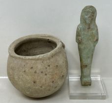 An Egyptian Ushabti style figure, 10 cm high, and a Roman style stoneware pot (2)