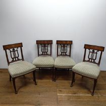 A set of four mahogany dining chairs, with carved lyre backs (4)