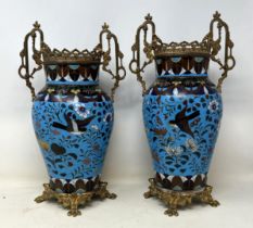 A pair of cloisonné vases, decorated flowers and birds, and with gilt metal mounts, 24 cm high (2)