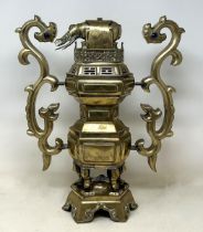 A Chinese brass censer, with an elephant finial, 48 cm high