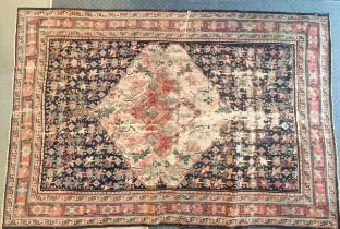 A Persian blue ground rug, 220 x 130 cm Very worn. See images