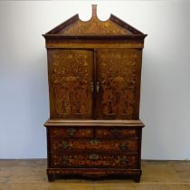 A 19th century Dutch mahogany linen press, with floral marquetry decoration, the two cupboard