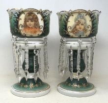 A pair of glass lustres with prismatic drops, decorated children, 30 cm high (2) transfer printed,
