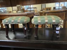 A pair of mahogany footstools, on turned feet, 28 cm wide